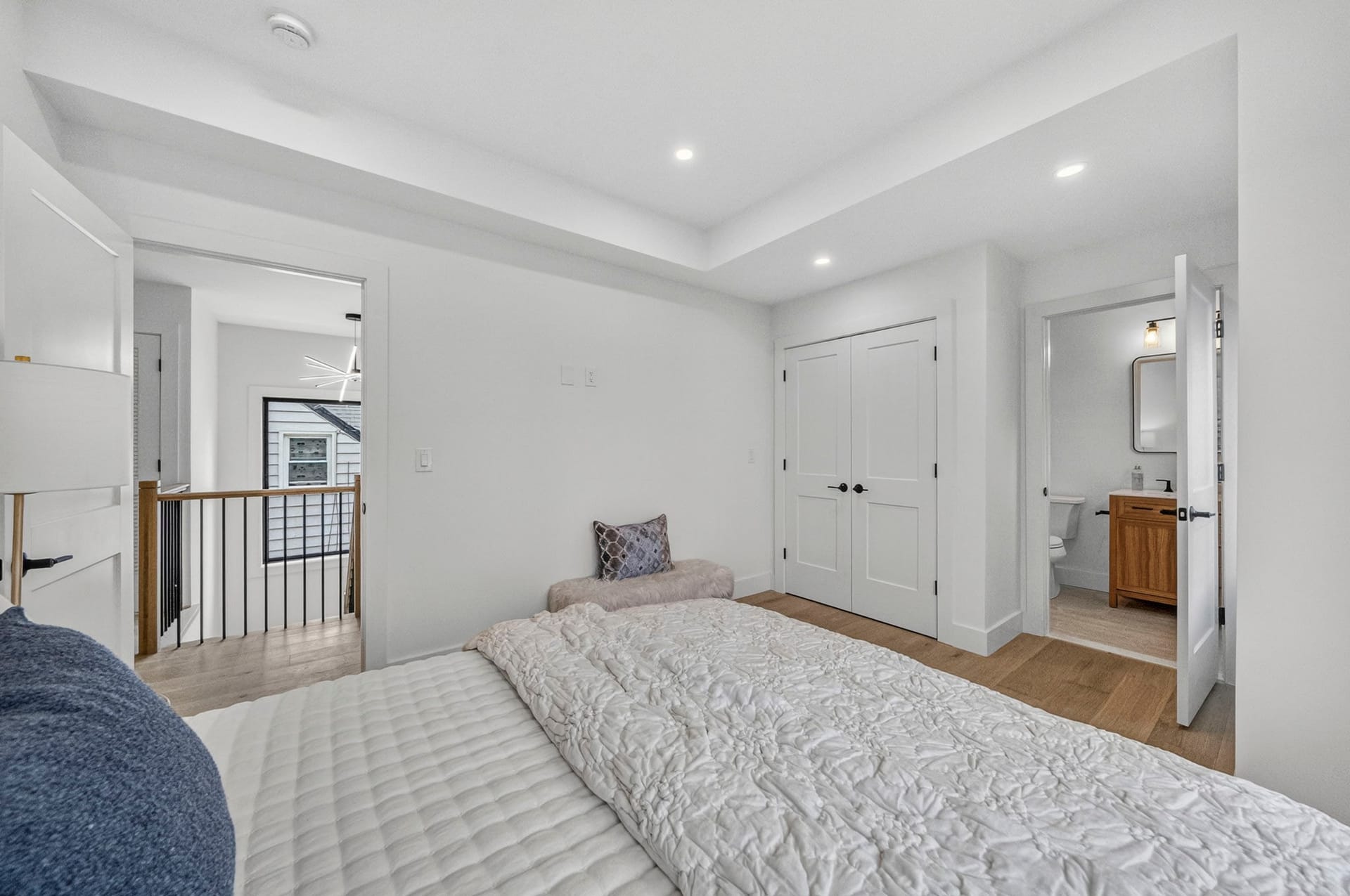 Bedroom loft space overlooking the stairwell with an en-suite bathroom